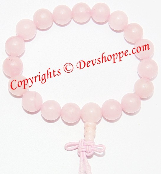 Rose quartz power bracelet with round pale pink beads and tied cord closure