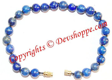Lapis lazuli beads bracelet with blue stones and small gold clasp, threaded elastic
