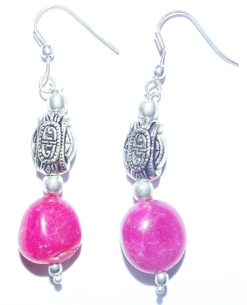 Pink Jade earrings with silver hooks, pink round jade beads, and ornate silver spacers.