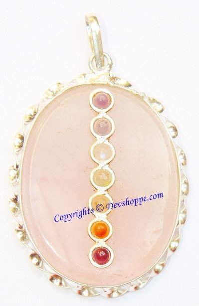 Round rose quartz pendant with gold-tone setting and five chakra bead drops