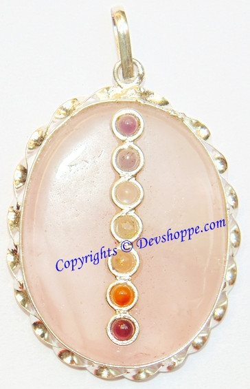 Round rose quartz pendant with gold-tone setting and five chakra bead drops