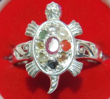 Silver tortoise-shaped ring with oval bezel and Navratna multicolor stones