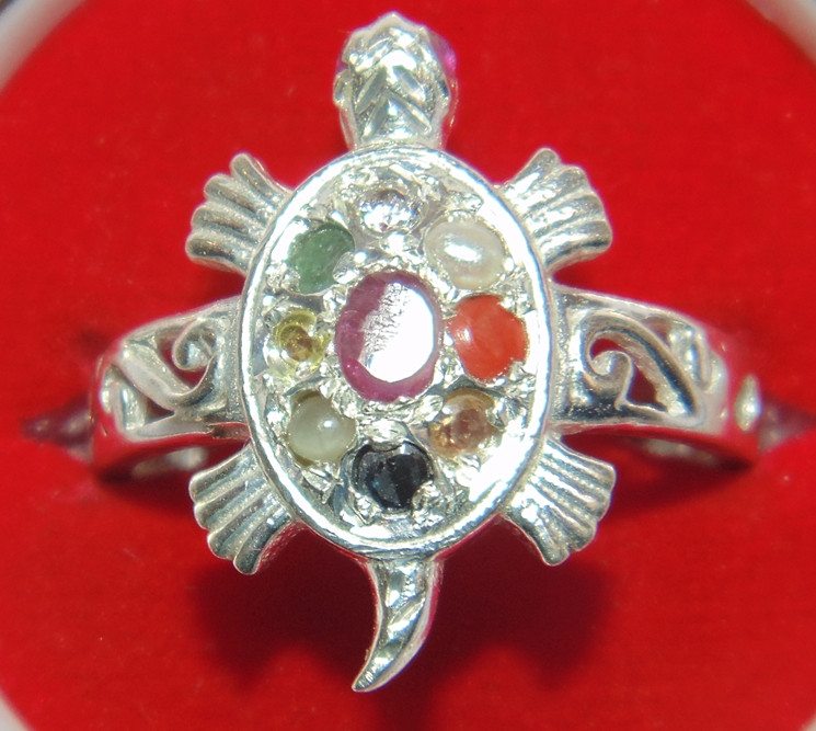 Silver tortoise-shaped ring with oval bezel and Navratna multicolor stones