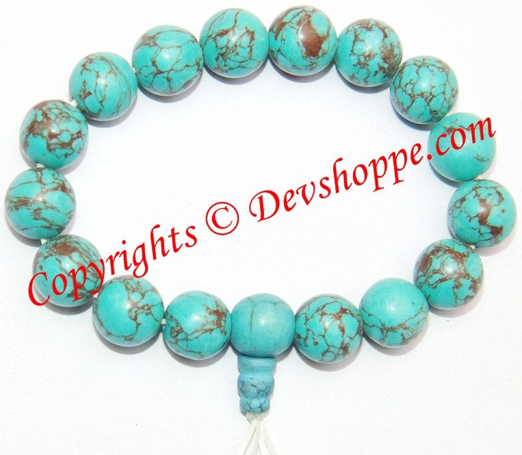 Turquoise power bracelet with round turquoise beads and brown veining, beaded stretch style
