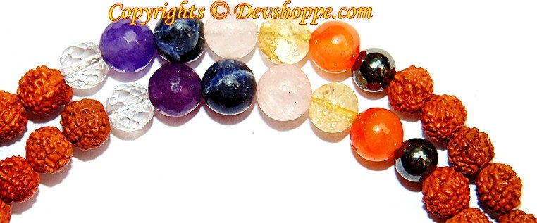 Multi-stone bead strand with orange, purple, white, and brown rudraksha beads
