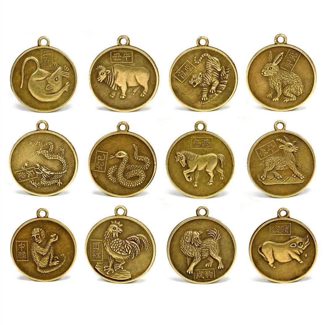 Set of 12 Chinese zodiac coins, gold-toned round charms with hanging loops and animals