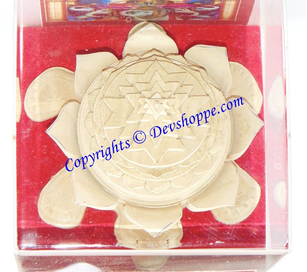 Close view of Meru yantra atop tortoise base, cream geometric star and layered lotus