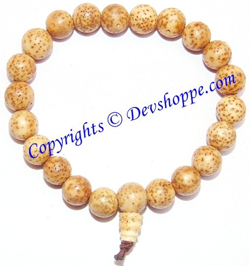 Tibetan buddha bodhi seed bead bracelet with speckled tan beads and tassel