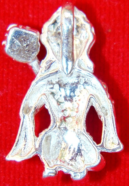 Pure silver Hanuman sitting pendant, detailed face and hands in front view