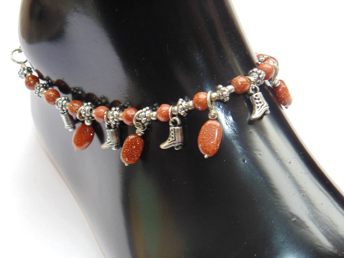 Sunstone bead anklet with orange stones, silver charms and black bead accents