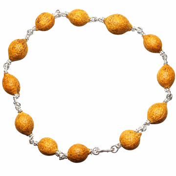 Seed bracelet with white metal wire and natural seed beads, oval beads and chain links