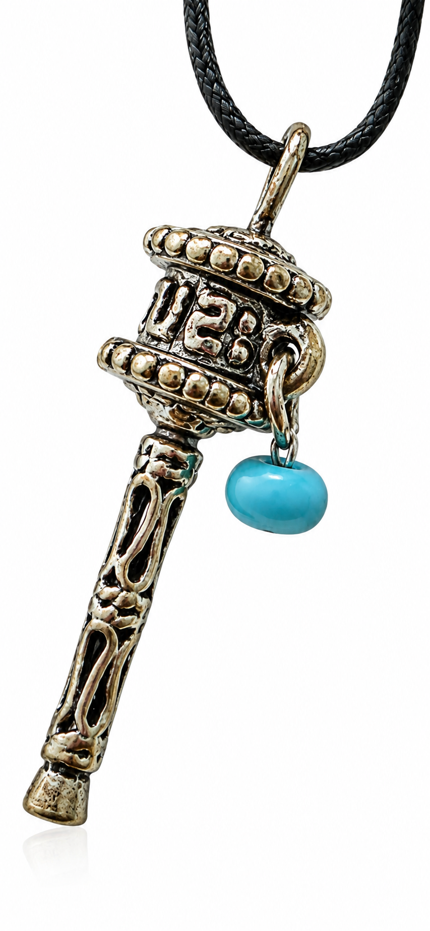 Prayer wheel pendant necklace close-up with turquoise bead on dark cord