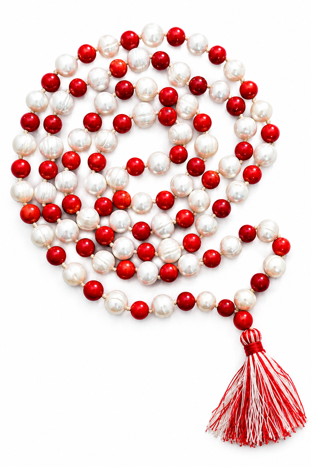 Pearl and coral mala necklace with white pearl strands, red beads, and tassel