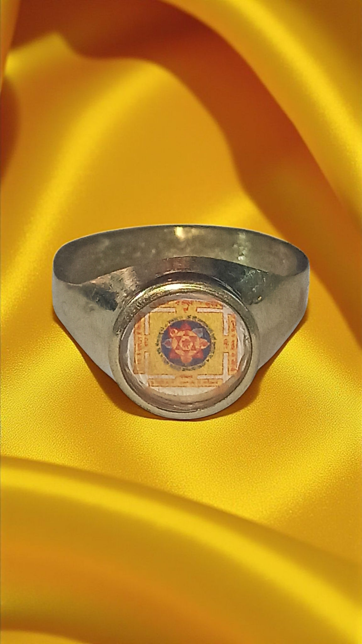 Brass Sri Baglamukhi yantra ring with circular engraved symbol on oval setting