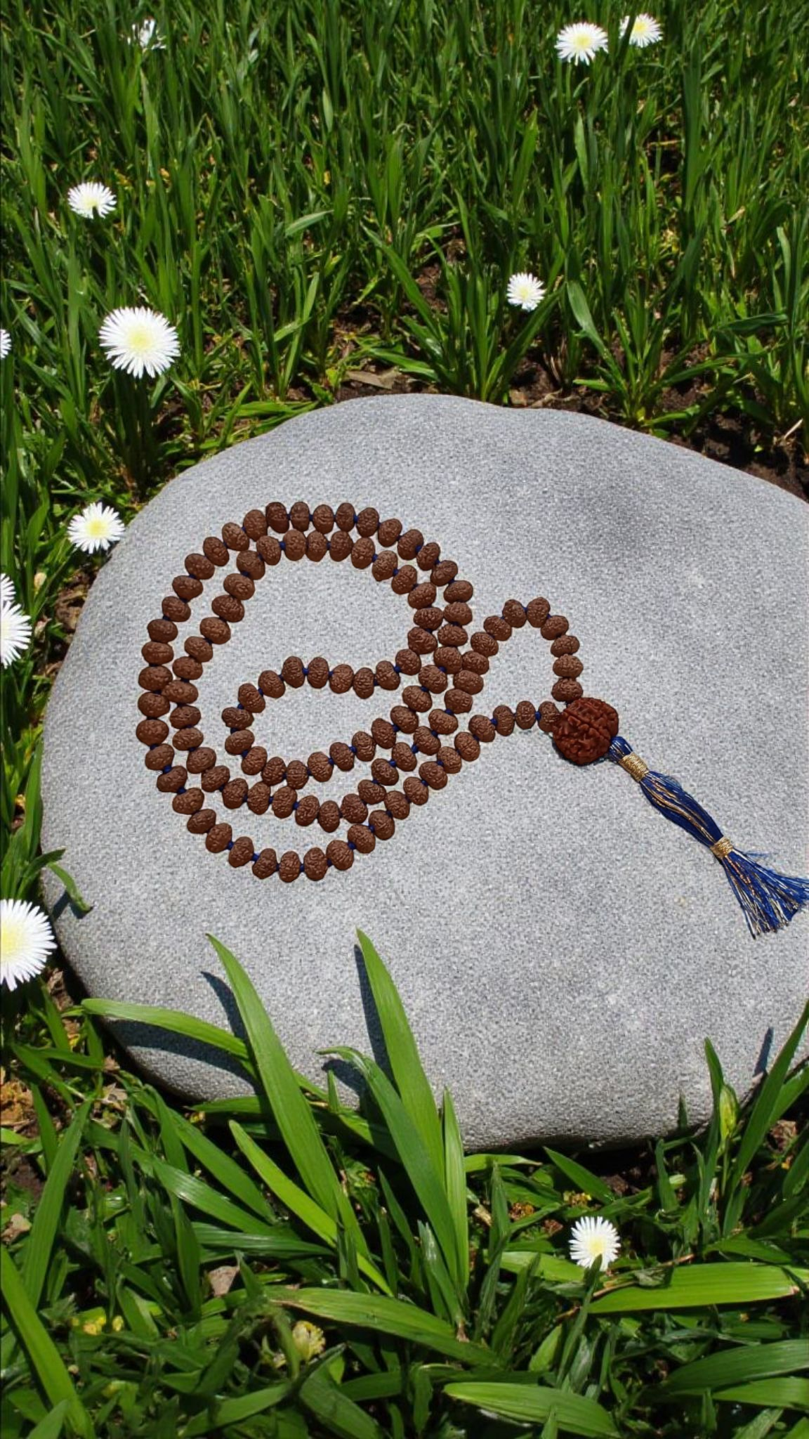 Seven-faced rudraksha mala necklace with blue tassel and bead sumeru