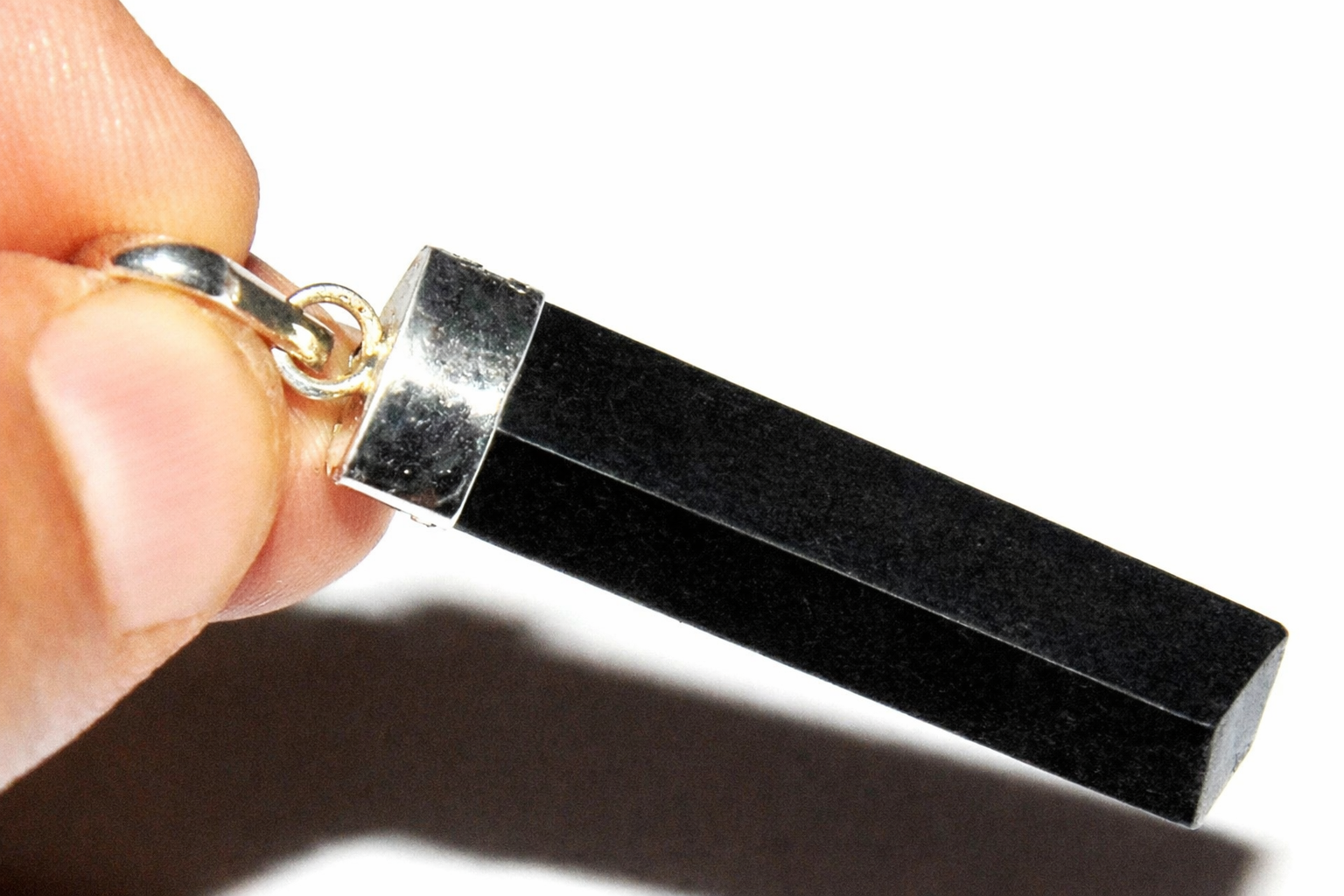 Black tourmaline pendant with silver-toned bail and rectangular stone
