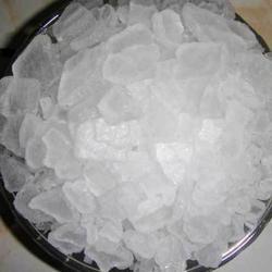 White camphor crystals in a bowl, natural plant-derived crystal pieces