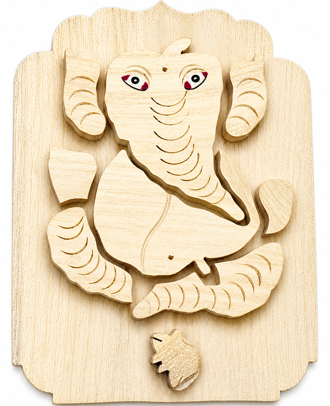 Wooden Vastu Ganesha wall hanging with carved trunk and smiling face, light wood