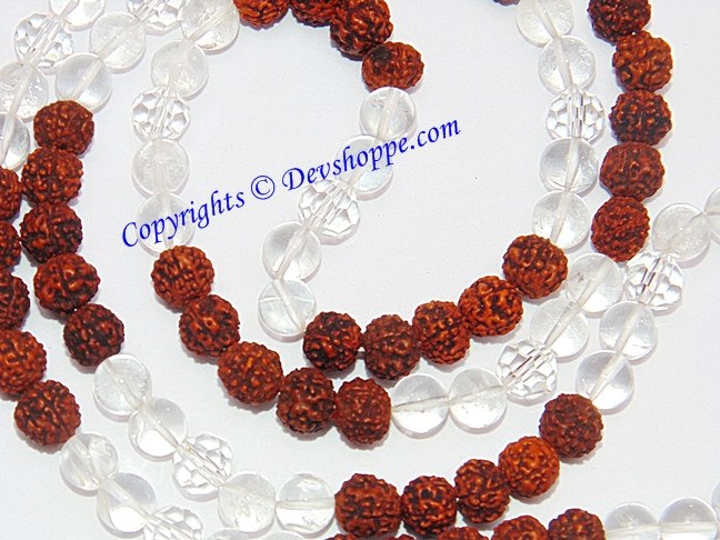 Close-up Rudraksha Sphatik mala: brown textured beads with white/clear crystal links