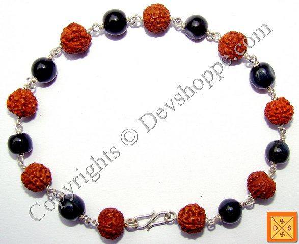 Rudraksha & cat's eye bead bracelet: red textured beads, black round stones, silver chain clasp