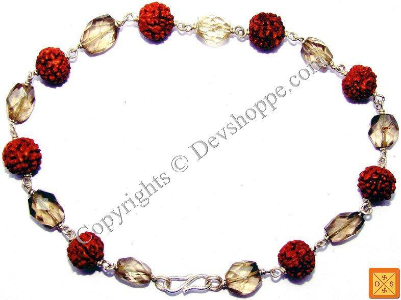 Smokey quartz faceted beads and red rudraksha-style beads on silver bracelet
