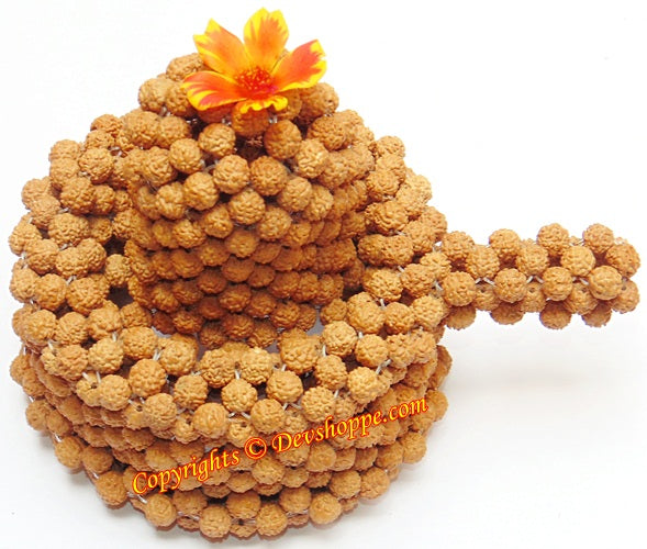 Rudraksha shivling of brown 5 mukhi bead clusters with orange flower on top