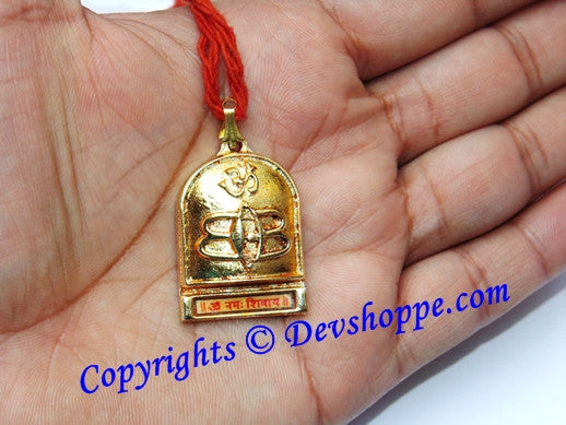 Gold Shiva trinetra/Tripunda pendant with red thread loop