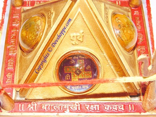 Sri Baglamukhi Raksha Yantra Chowki close-up, gold triangle with inner deity artwork
