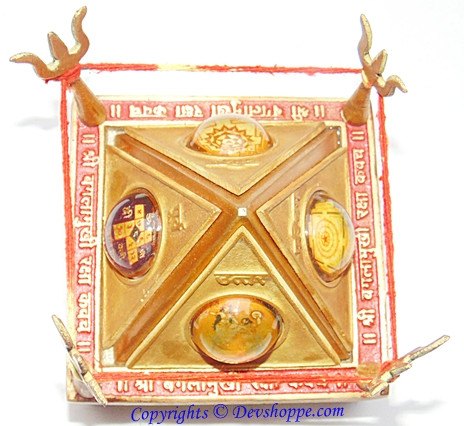 Sri Baglamukhi Raksha Yantra Chowki, gold yantra on red-framed stand with four corner posts