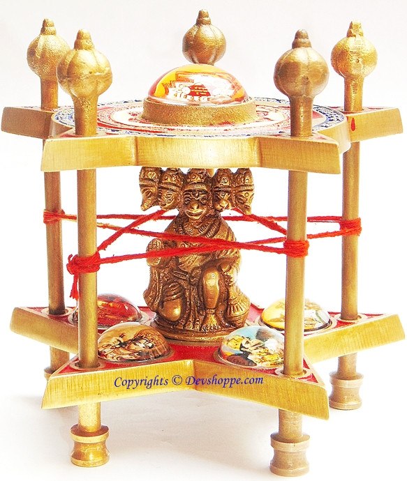 Hanuman yantra chowki with five-faced Hanuman idol on wooden tiered stand