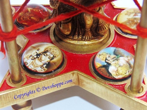 Wooden chowki base with red star design, five-faced Hanuman idol and side medallions