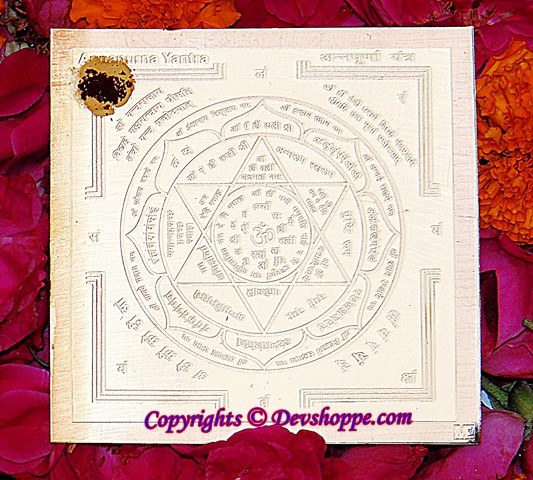 Sri Annapurna yantra on cream paper, circular geometric Hindu design with symbols