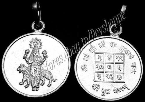 Silver round yantra pendant with deity figure on one side and engraved symbols on other