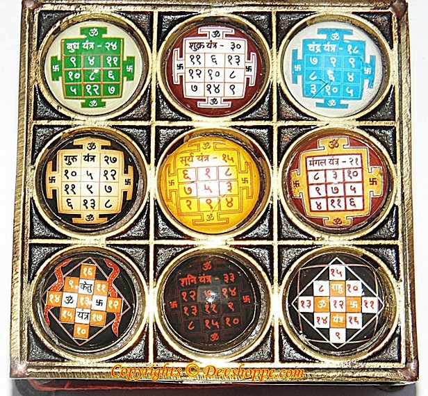 Brass yantra chowki with nine circular Navgraha tablets in multicolor