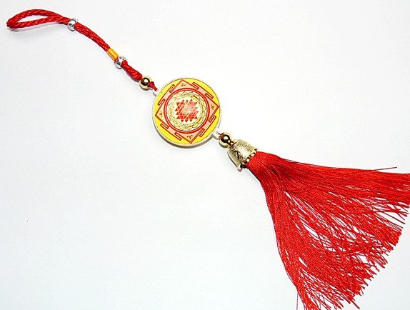 Round Sriyantra yantra pendant with red tassel cord and gold beads