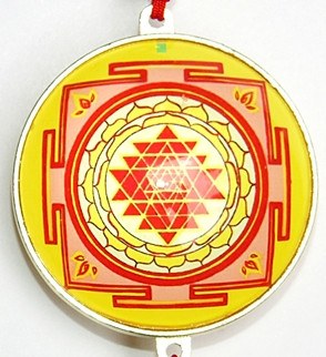 Yellow-and-red circular yantra design with silver rim and hanging loop