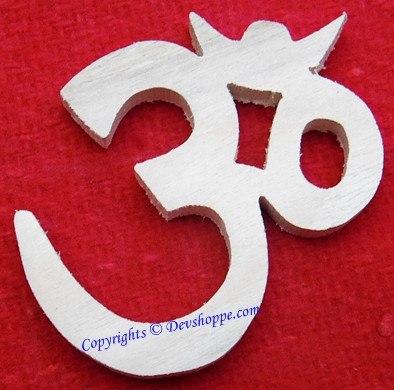 Auspicious Aum (Om) mantra symbol carved out of sacred Shriparni wood